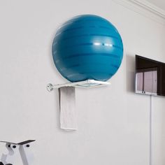 an exercise ball mounted to the wall in a living room