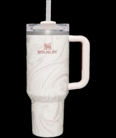 a white travel mug with a straw in the top and handle is shown against a white background