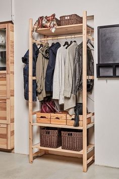 an organized closet with clothes and other items