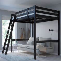 a loft bed with a couch underneath it