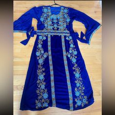 Custom Made Blue Velvet Heavily Beaded All Of The Design Is Sewn In Beads Only Worn Once Perfect Condition Back Is Empty No Beading Fits Large / Xlarge Blue Bollywood Kaftan With Resham Embroidery, Bollywood Style Blue Kaftan With Resham Embroidery, Blue Dabka Work Kaftan For Festivals, Festive Blue Kaftan With Zari Work, Festive Blue Zari Work Kaftan, Festive Bollywood Blue Kaftan, Blue Festive Kaftan With Dabka Work, Festive Blue Kaftan With Dabka Work, Blue Bollywood Style Kaftan For Parties