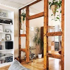 a living room filled with lots of wooden furniture