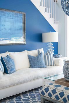 a living room with blue and white decor