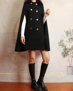 * A cool wool cape coat, very elegant. * With double breasted gold buttons, very beautiful.  * If you want black buttons, please let us know, thanks. * Material: out shell - 50% wool, 50% polyester; lining - 100% polyester * Care: dry cleanable * Shop sizing chart FYI ( made according to US sizing. actual body figures, not laying flat clothes measurements) Size XS (US 2, UK 6, German 32, French 34, ) Bust: fits bust around 33.5 inches/85cm Waist: fits waist around 26 inches/66cm Hips: fits hips around 36 inches/91cm  Size S (US 6, UK 10, German 36, French 38) Bust: fits bust around 35.5 inches/90cm Waist: fits waist around 28 inches/71cm Hips: fits hips around 38 inches/97cm Size M ( US 10, UK 14, German 40, French 42) Bust: fits bust around 37.5 inches/95cm Waist: fits waist around 30 inc Long Sleeve Cape With Buttons For Fall, Winter Cape With Button Closure, Winter Long Sleeve Cape With Buttons, Winter Long Sleeve Button Cape, Elegant Cape-style Outerwear With Buttons, Winter Cape Outerwear With Button Closure, Chic Winter Wool Cape Coat, Chic Double-breasted Wool Coat With Buttons, Elegant Winter Outerwear With Gold Buttons