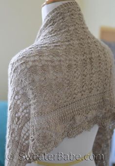 a woman's shawl is shown on a mannequin