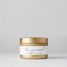 a gold tin with a white label that says, i'm not afraid to see what this candle is