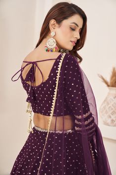 This is a 3-piece set. The set consists of sleeveless blouse with sequins & zari detailing, round neck teamed with flared matching lehenga and a dupatta. No of piece - 3 piece Color- Purple Fabric-Georgette Dupatta Fabric - Georgette Blouse Sleeves-Sleeveless Neck-Round Neck Lehenga length: Floor Length Washing instructions: Dry Clean Work- Zari & Sequins Print Detailing. Flared lehenga Comes with Dupatta Customizations: available. Please add your measurements in the 'order notes' box during che Matching Lehenga, Engagement Gown, Lehenga Crop Top, Georgette Material, Bridesmaid Lehenga, Georgette Lehenga, Lehenga Choli Wedding, Stitched Lehenga, Party Wear Lehenga Choli