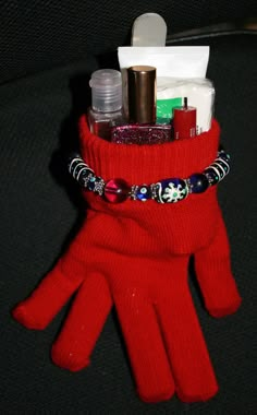 a red glove that has some items in it