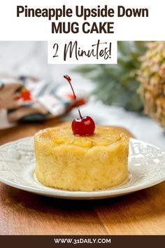 pineapple upside down cake on a plate with text overlay that reads pineapple upside down mug cake 2 minutes