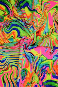 multicolored fabric with wavy lines and swirls in the center, as well as an abstract background