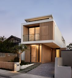 a modern house with wooden slats on the front