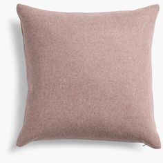 a pink pillow on a white background