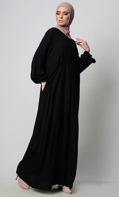 A perfect wardrobe piece for minimalistic style Simple and classy details A stylish abaya with a waist detail adding panel, gather and pleat Includes both side pockets Round neck basic style Full Sleeves FABRIC: Rayon CARE: Machine wash cold Elegant Solid Color Abaya With Modesty Panel, Solid Color Maxi Length Abaya For Work, Modest Abaya With Modesty Panel, Solid Maxi Length Abaya For Work, Fall Solid Color Maxi Length Abaya, Solid Color Long Sleeve Abaya For Work, Long Sleeve Abaya For Work, Solid Long Sleeve Abaya For Work, Modest Solid Color Maxi Dress