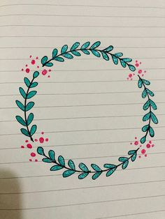 a drawing of a circle with leaves and berries on it, drawn in pencils