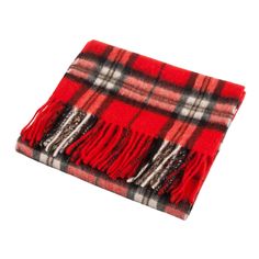 Model: A03248_THOMSON RED 100% Lambswool Size: 56 inch x 12 inch Tartan / Plain / Multicolour Scarf Cosy and warm with an extra-soft finish EDINBURGH LAMBSWOOL Multicolor Scarf. This beautifully crafted lambswool scarf is a key accessory to your winter wardrobe. Wrap it over your outerwear as the weather turns colder to instantly add a stylish finish. Edinburgh Lambswool uses only the finest lambswool in the production of their knitwear which has strong natural qualities and is soft and comforta Red Wool Winter Scarves, Red Wool Scarves For Winter, Classic Red Scarves For Winter, Tartan Scarf, Scottish Jewellery, Cashmere Blanket, Key Accessories, Scottish Tartans, Cashmere Scarf