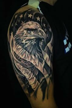 an eagle with the american flag on his arm