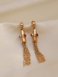 * Earring Material: Tourmaline, 14K yellow gold * Earring Dimensions: 1.75 inch length * Stone Weight & sizes: Cabochon 2.3mm * Overall weight: 4.7 grams 14k Yellow Gold Linear Earrings For Evening, Evening 14k Yellow Gold Linear Earrings, 14k Gold Dangle Linear Earrings For Evening, 14k Gold Dangle Earrings For Evening, Classic 14k Gold Long Drop Earrings, 14k Gold Long Drop Linear Earrings For Anniversary, Yellow Gold 14k Gemstone Earrings, Timeless Gold Earrings, 14k Gold Fine Jewelry Linear Drop Earrings