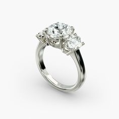 three stone diamond ring on white background