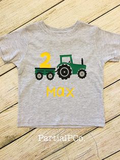 A personalized tractor t-shirt OR raglan for your little boy's birthday. Choose between a white or light gray regular t-shirt OR a raglan (baseball) shirt (white with black sleeves in infant sizes and gray with charcoal sleeves for toddler sizes) and red or green tractor. Also choose which birthday number to put in the wagon! ** Listing is for one infant/toddler shirt only. You can find matching adult shirts for mom and dad here: https://www.etsy.com/listing/645034540/matching-tractor-birthday-s Personalized Birthday Shirts, First Birthday Shirts, Happy 2nd Birthday, Adulting Shirts, Birthday Shirt