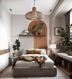 a white bed sitting under a hanging light next to a potted plant in a bedroom