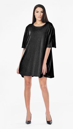 Get ready to shine in the ANNIE SEQUIN T-SHIRT DRESS! This versatile dress is perfect for any special occasion, with shimmering sequins that catch the light and add a touch of luxury to your wardrobe. You'll love the comfortable, glamorous, and effortless style of the ANNIE SEQUIN T-SHIRT DRESS! 🖤 this model who is a size S is photographed in a size L for extra movement. If you want that please size up 1-2 sizes. Choose your desired size for a shift-like fit (with room for movement) like how Da Chic Short Sleeve Sequin Dress For Party Season, Glamorous Short Sleeve Holiday Dresses, Sequin Short Sleeve Night Out Dress, Chic Short Sleeve Sequin Dress, Sequin Short Sleeve Dresses For Night Out, Sparkling Metallic Dress For Summer, Short Sleeve Glitter Dress For Party Season, Metallic Shimmer Sequin Holiday Dress, Metallic Sequin Holiday Dress With Shimmer