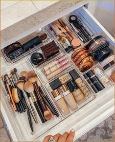 the drawers are filled with makeup and cosmetics