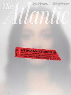 a woman's face is shown behind an ad for the atlantic, with a red tube sticking out of her mouth