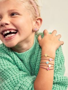 The Sweetheart Kids' Pisa Bracelet Set comes with five unique gold beaded bracelets. Each bracelet is complete with a heart bead in the center in a range of bright colors. Gift as a set to your little one, or split them apart to gift to them and all of their friends. READY TO GIFT: This item comes pre-packaged in a beautiful box.Please note: intended for children 3+ Valentine's Day Playful Beaded Jewelry, Adjustable Gold Heart Bracelet With Colorful Beads, Cute Heart Beads Charm Bracelet For Valentine's Day, Trendy Gold Beaded Heart Bracelet, Playful Heart Beads Jewelry For Birthday, Playful Heart-shaped Beaded Bracelets For Gift, Playful Friendship Bracelets With Heart Beads For Gift, Playful Heart-shaped Beaded Bracelets As Gift, Cute Heart Beads Charm Bracelet