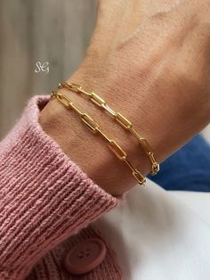 "available in: 14k solid gold length: comes with 6.3' inches ( 16 cm) chain with 2\" inches (5 cm) extension for fine tuning if you wish to wear your bracelet shorter or longer, always feel free to send a message ♡ shipping: ♡ all our listings include free expedited shipping delivers in 2-4 business days care tips : we want you to wear your jewelry for a long long time happily so, to maintain the quality of your new jewelry, please: ♡ do not wear it to the pool, spa, or the beach ♡ remove when s Classic Bracelets With Paperclip Chain For Gifts, Classic Paperclip Chain Bracelets As Gift, Classic Paperclip Chain Bracelet As Gift, Gold Link Bracelet As Gift, Gold Link Bracelet Gift, Dainty Link Chain Bracelet For Formal Occasions, Classic Gold Cable Chain Bracelet For Gift, Classic Gold Cable Chain Bracelet Gift, Yellow Gold Link Chain Bracelet For Gift