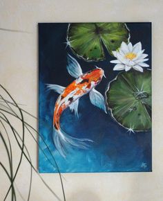 a painting of a koi fish and lily pads on a white wall next to a potted plant