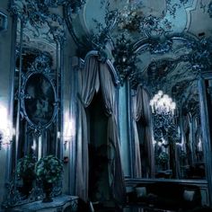 an ornately decorated room with mirrors and chandeliers