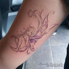 a tattoo on the leg of a woman with a flower in her hair and a fairy tail