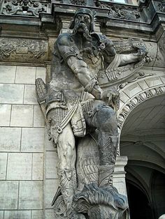 a statue on the side of a building