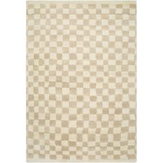 a beige and white rug with checkered squares on the bottom, in different sizes