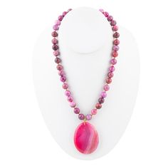 This stunning necklace features genuine pink magenta beads strung together with a beautiful magenta agate slab pendant. The necklace is 17 inches long with an additional 2 inch extender and a secure lobster clasp closure. The pendant measures 2 inches in length and 1.75 inches in width, making it a statement piece. Handcrafted with care, this necklace is sure to stand out with its vibrant pink magenta colors. It weighs 3.5 ounces, making it a comfortable and lightweight accessory to wear. Agate Description: Agate is a variety of chalcedony characterized by its fine grains and bright, multi-colored bands that range from nearly every hue. Commonly found in volcanic rocks, it forms as layers of silica fill cavities within rock, creating its signature banded appearance. Agates are highly versa Adjustable Pink Agate Necklace, Pink Agate Beaded Necklace, Pink Agate Gemstone Bead Necklace, Pink Agate Beaded Necklaces, Pink Agate Pendant Necklace, Volcanic Rock, Fire Agate, Fiery Red, Blue Lace Agate