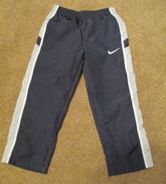 Nike Boys  NAVY BLUE Track Athletic Pants size 4 Brand New With Tags PLEASE NOTE: PICTURES SOMETIMES SHOW DIFFERENT SHADES OF COLOR.  I STRUGGLE WITH MY CAMERA LIGHTING AND THE LIGHTING IN MY HOUSE. THEREFORE, THE ACTUAL COLOR OF THE ITEM MAY VARY SLIGHTLY FROM THE PICTURES.                                      Please contact me if you have any questions. Payment is due no later than 3 days after the auction ends. Thanks for taking a look.                      Payment Payment is due within 3 day Nike Boys Track Pants, Nike Boys, Nike Boy, Athletic Pants, My House, Cool Kids, Parachute Pants, Georgia, Sweatpants