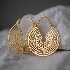 Our Anthemia Ear Hangers are Sterling Silver 925. Order them with your choice of plating: Rhodium or Gold 24K! The Anthemia Ear Hangers come with a high gloss finish.  Each Anthemia earring measures approximately 40 x 33 mm. A stunning ear hangers piece from our Motifs Collection. Sold as a pair, for standard pierced and  stretched ears alike.  HANDMADE IN GREECE We make your jewelry especially for you. Once your order is created & your payment is verified, it will take 5-7 business days for pro Bohemian Gold Hallmarked Jewelry, Symbolic Hallmarked Metal Jewelry, Metal Hoop Jewelry With Intricate Design, Nickel Free Traditional Yellow Gold Jewelry, Symbolic 14k Gold Pierced Jewelry, Unique Gold Jewelry With Intricate Design, Traditional Nickel Free Gold Plated Jewelry, Engraved Hoop Jewelry As Gift, Filigree Hoop Jewelry As A Gift