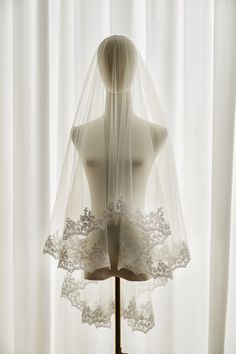 a mannequin with a veil on top of it