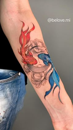 a woman with a tattoo on her arm holding a fish and flower bouquet in it