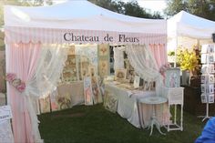 a tent set up with tables and chairs