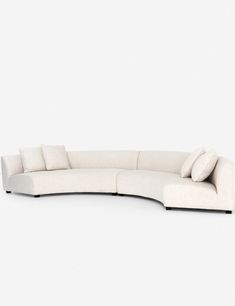 a white couch with pillows on it