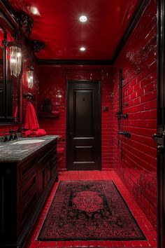 a bathroom with red walls and flooring is pictured in this image, it appears to be very dark