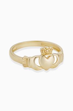 Let this Irish inspired piece guide you with all you hold dearest. A solid gold heart topped with a crown and hugged by a pair of hands, the Claddagh is an eternal symbol of love, loyalty and friendship.  Metal: 14 Karat Yellow Gold Dimensions: 4mm Wide Weight: 1.9 Grams Origin: Crafted in Istanbul, Turkey Irish Heart Ring, Irish Claddagh Rings, Eternal Symbol, Irish Ring Claddagh, Claddagh Ring, Claddagh Rings, Heart Top, Istanbul Turkey, Love Symbols