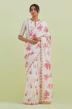 Off-white saree featuring floral hand block print all over, thread, mirror embroidered hem with ricrac detailing. Paired with a hand block printed, embroidered blouse. - Aza Fashions White Cotton Silk Pre-draped Saree, White Handloom Blouse For Wedding, White Handloom Blouse For Festive Occasions, Fitted White Cotton Silk Saree, Festive White Handloom Blouse, White Blouse Piece With Printed Motifs In Traditional Drape, White Wedding Blouse Piece With Printed Motifs, Fitted White Handloom Saree, Off White Saree