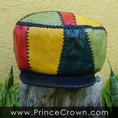 Size LARGE / Height 6 inches Rim 56 cm or 22 inches (to go over your head) Rasta Leather Hat made from variations of Red Gold Green and Blue leather. GENUINE LEATHER RASTA CROWN Prince Crown Hand Crafted Rasta Hat made from Genuine Designer Leather ☼ Hand Crafted and Hand Stitched ☼ 100% Leather exterior and lacing ☼ Stylish and useful, versatile and comfortable. ☼ Product of Jamaica, made in Jamaica by Jamaicans Pick one to fit your personality, your wardrobe... or gift one to someone special a Handmade Leather Brimmed Hat, Artisan Leather Brimmed Hats, Handmade Leather Hat With Flat Brim, Retro Leather Cap, Handmade Artisan Leather Hat, Artisan Handmade Leather Hat, Handmade Vintage Leather Hat, Vintage Handmade Leather Hat, Rasta Hat