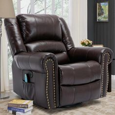 a brown reclining chair with studded trimmings on the arms and back