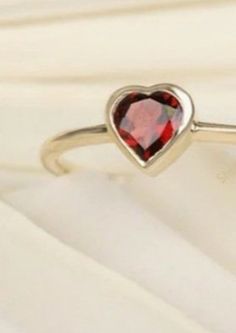 Happy merry Christmas day Natural Garnet Heart Ring | Anniversary ring Promises ring | Propose ring Engagement ring Women ring | handmade items Materials: Gold Gemstone: Garnet Gem color: Red Band color: gold This Beautiful Heart Shaped Solitaire Ring is a stylish way to celebrate your love. The center stone is vibrant Garnet stone, set in a classic Gold Plated Sterling Silver band. The Heart-Shaped Stone features an expert cut, shining brilliantly in this exquisite piece. Metal - Gold Plated Sterling Silver Metal Weight -2.10gm Main Stone - Garnet Main Stone Shape - Heart Main Stone Color - Red Main Stone Weight - 1.00ct Open Crystal Ring For Valentine's Day Promise, Valentine's Day Proposal Open Ring Jewelry, Heart Cut Ring For Valentine's Day Gift, Round Crystal Ring For Valentine's Day Gift, Heart Shaped Crystal Promise Ring For Valentine's Day, Crystal Ring For Valentine's Day Gift, Red Open Ring For Valentine's Day, Open Ring For Valentine's Day Promise, Crystal Open Ring For Anniversary And Valentine's Day