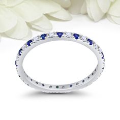 "Make a purchase of $50 or more and receive 10% Off Use Coupon Code \"JOON10OFF\" Ring Specifications: Metal: Sterling Silver Metal Purity: 92.5% Band Width: 2.5mm Gemstone: Simulated Diamond, Simulated Sapphire Gemstone Cut: Round Gemstone Color: Colorless, Blue Sapphire Gemstone Clarity: Flawless Gemstone Creation Method: Simulated Design: Eternity Plating: N/A Gift Box Included Don't know your ring size? Here you can find a link to a conversion table of all ring sizes of all country's: (copy Stackable Round Sapphire Ring For Anniversary, Sapphire Jewelry With Channel Set For Anniversary, Sapphire Stackable Diamond Ring For Anniversary, Sapphire Diamond Ring Channel Set For Wedding, Sapphire Round Cut Eternity Band For Anniversary, Sapphire Eternity Band For Anniversary, Blue Anniversary Eternity Band, Blue Round Eternity Band For Anniversary, Round Sapphire Ring With Channel Set For Anniversary