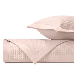 two pillows and a pillow on top of each other