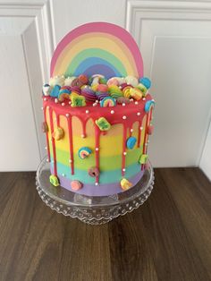 a multicolored cake with candy and candies on it